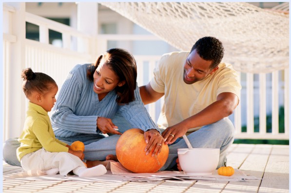 family carving a pumpkin together tips and tricks to jack-o-lanterns buddingmama
